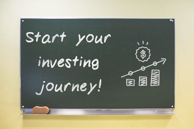 A chalkboard talking about an investment journey.