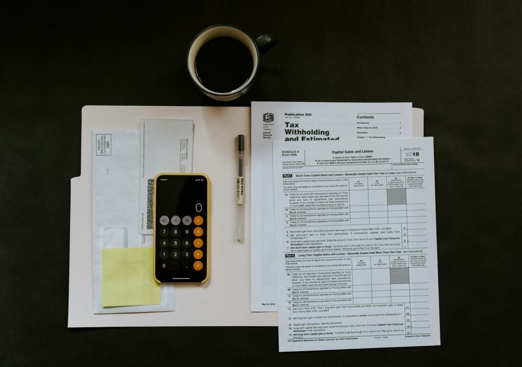 Tax forms with a coffee and calculator