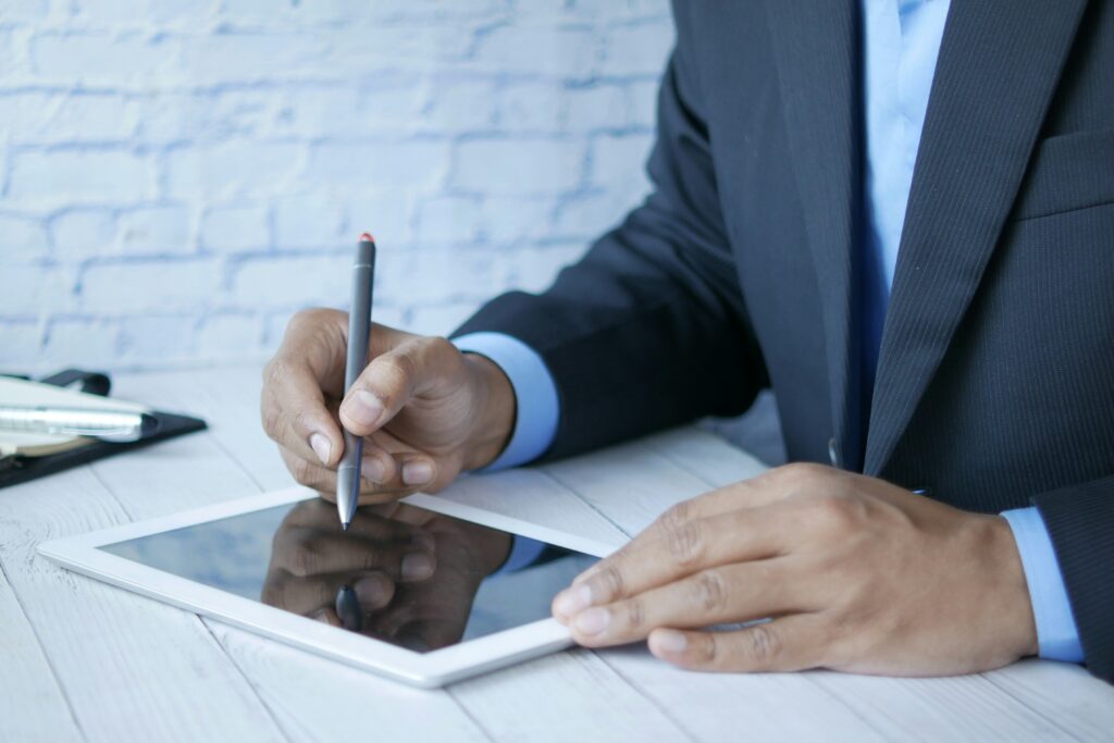 Man researching stocks on a tablet.