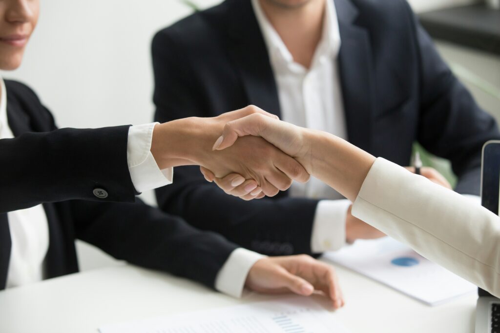 A private wealth manager shaking hands with the client