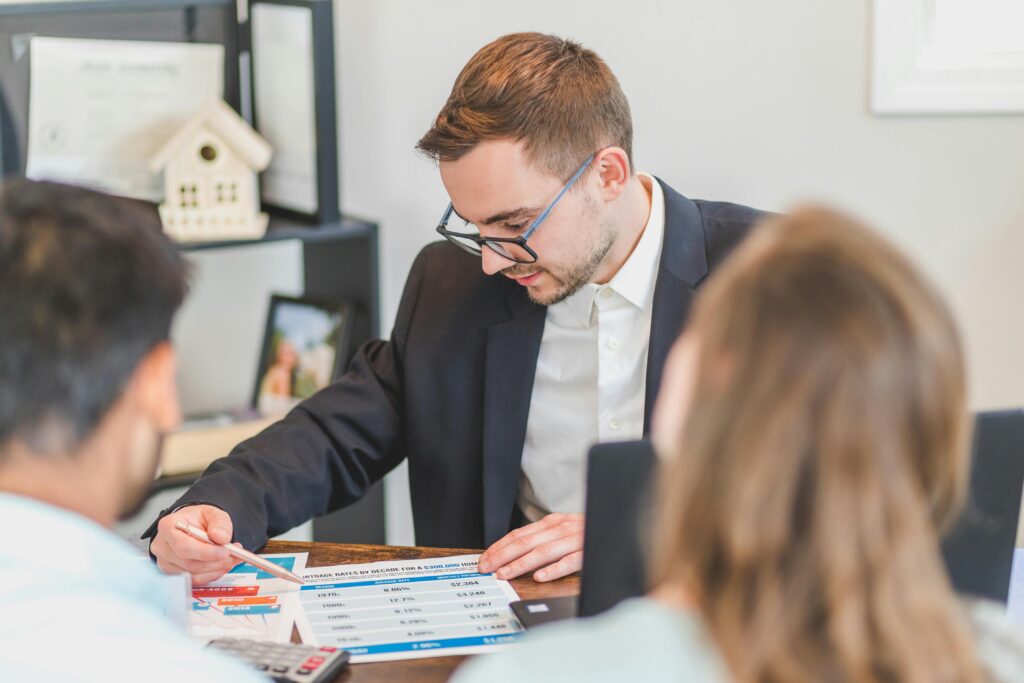 Private wealth management advisor takes clients through financial plans