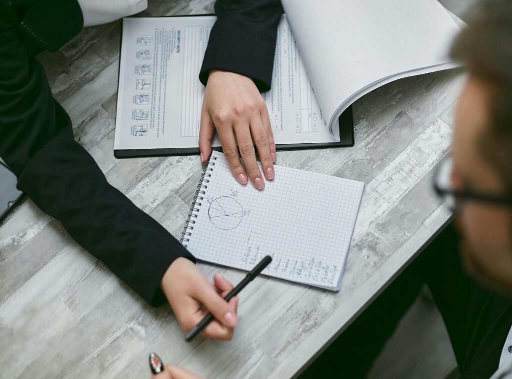 Wealth management advisor explains financial investment strategies to client