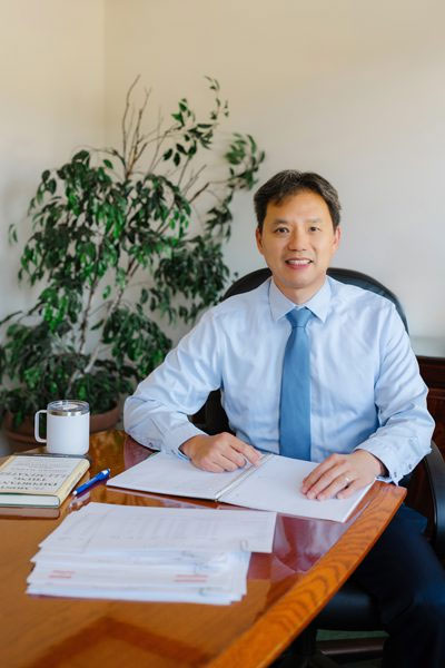Earl sitting at a table with an open notebook.