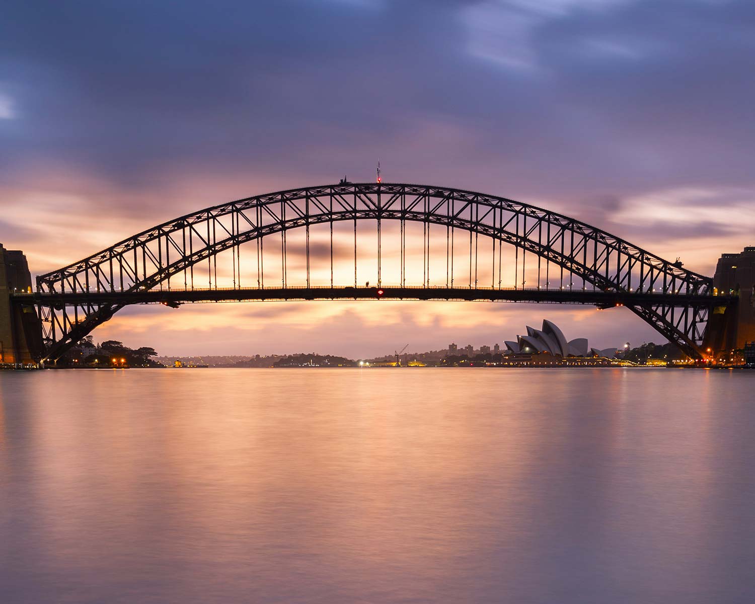 A bridge over water at dusk.