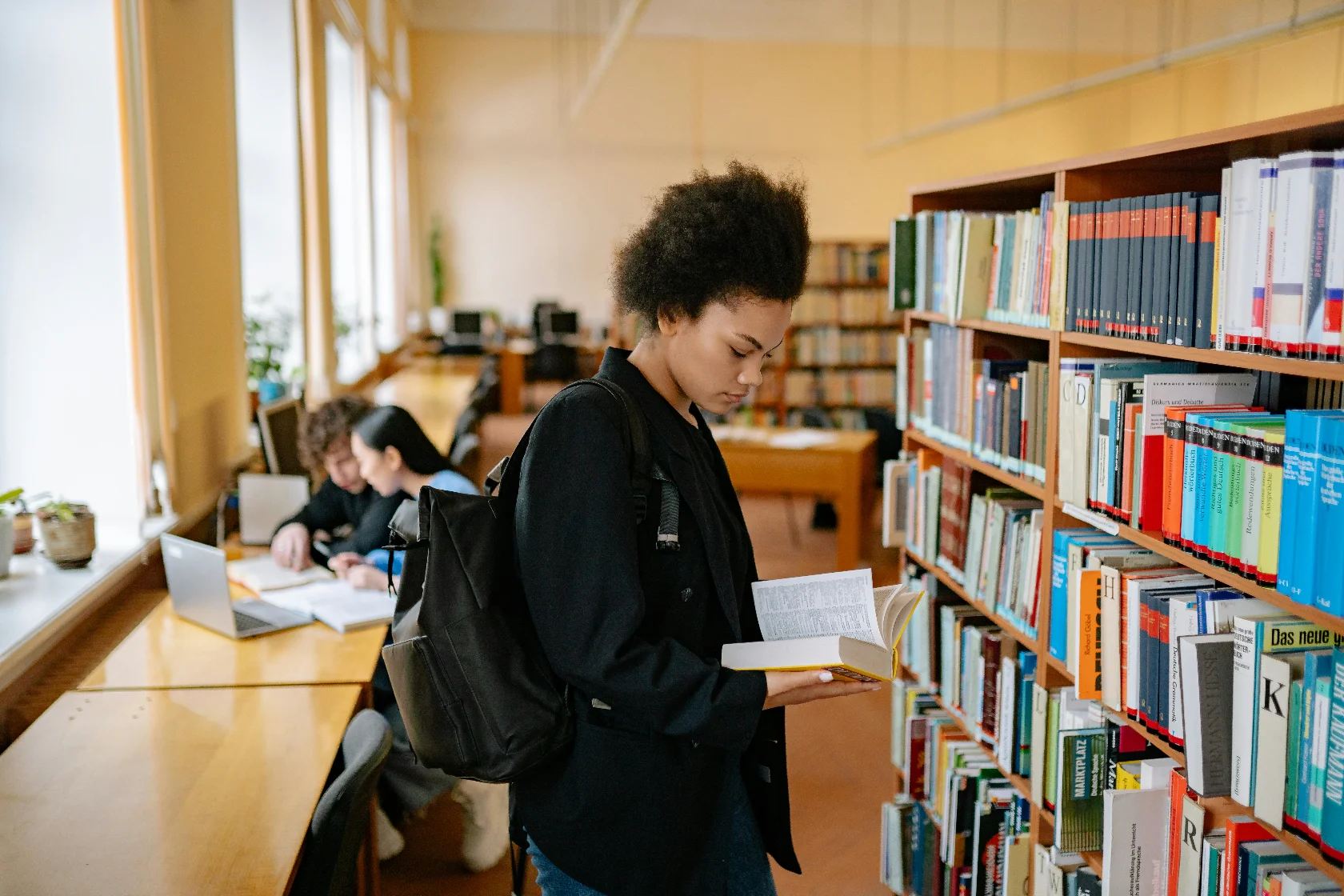 Student at a library benefiting from guardian education planning