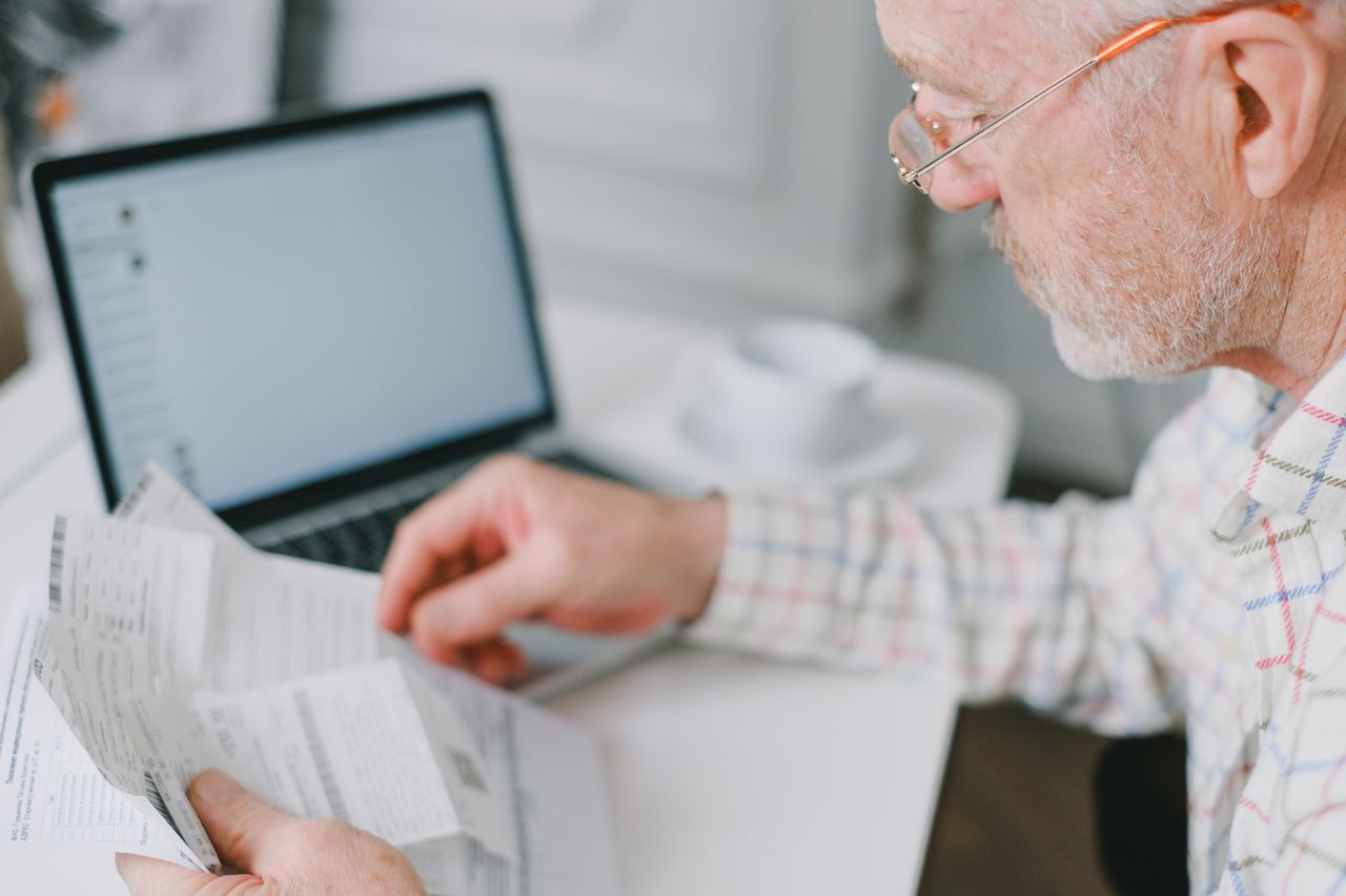 Elderly man reviewing investment strategies for his retirement